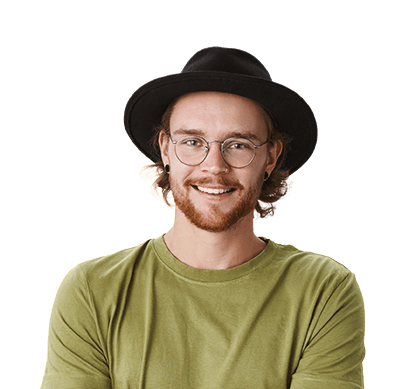 youngish man smiling and wearing glasses, a hat and an olive t-shirt